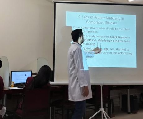 Aman, a Revive Research instructor, teaching how to write a letter to the editor
